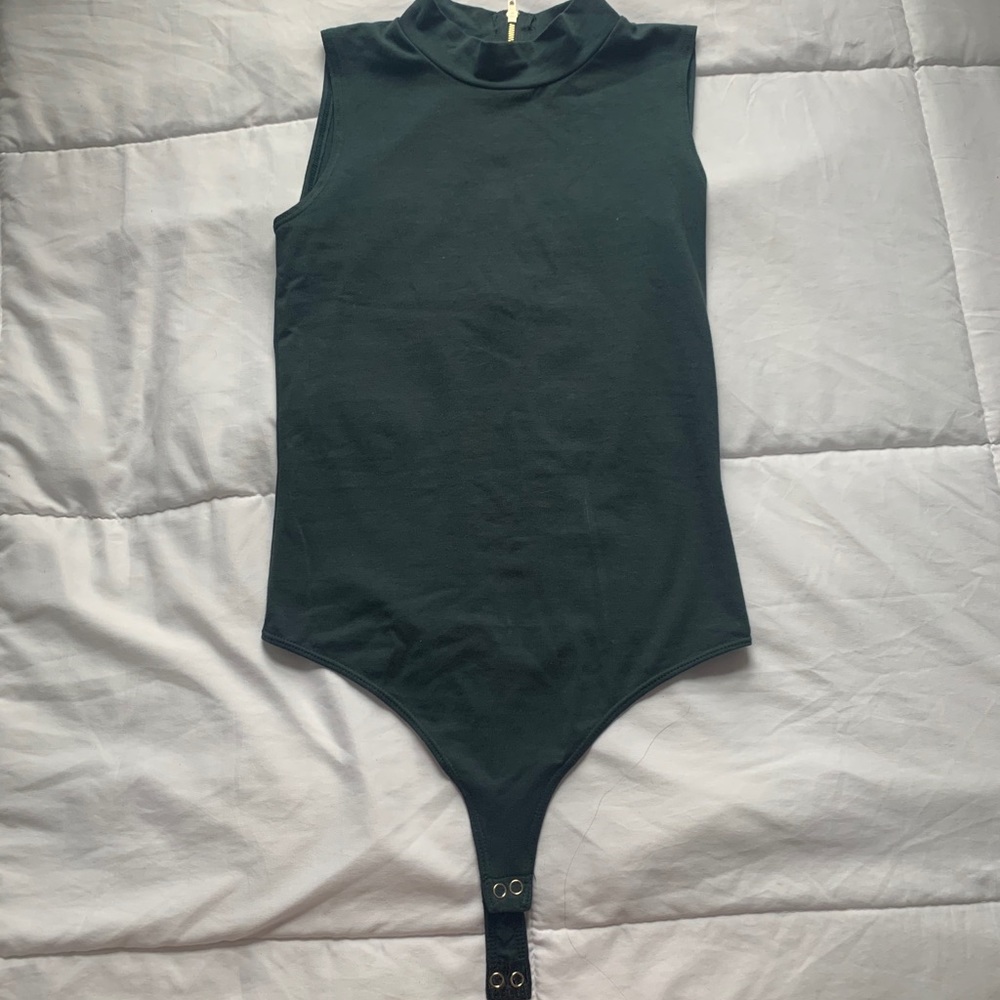 Green bodysuit. Size 8-10. Never worn before.